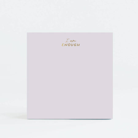 Purple square notepad with gold foil text saying, “I Am Enough” in top center.