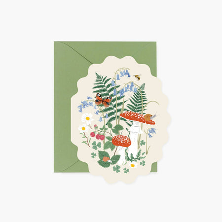 Ivory card with scalloped edge with images of mushrooms, green ferns, butterflies, white daisy flowers, blue flowers and a brown snail. A green envelope is included.