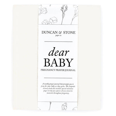 Ivory color journal with gold foil text saying, “Dear Baby Pregnancy and Prayer Journal” in center.