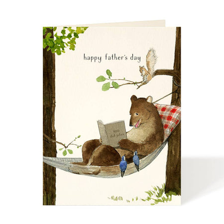 Ivory card with black text saying, “Happy Father’s Day”. Image of a brown bear relaxing in a hammock reading a book. A matching envelope is included.