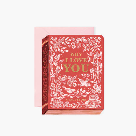 Red card in the image of a red book with white leaves, mushrooms, flowers and birds. Gold text in center saying, “Why I Love You”. Pink envelope is included.