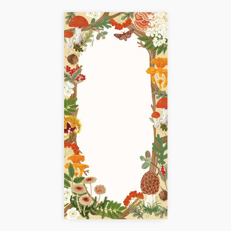 Ivory notepad with border images of flowers, mushrooms, pinecones and grass. 