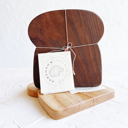 Wood cutting board in the shape of a slice of sandwich  bread.