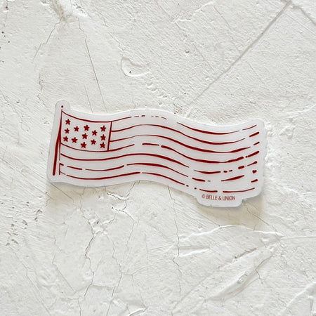 Translucent white sticker with image of an American flag all in red print.