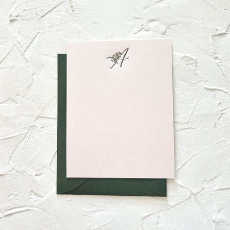 Blush pink notecard with olive green text with monogram letter per custom order. Matching olive green envelopes are included.