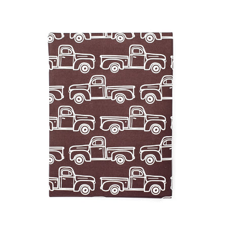 Maroon gift wrap sheet with images of white outlined pickup trucks.