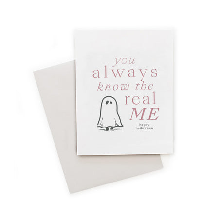 White card with pink text saying, “You Always Know the Real Me Happy Halloween”. Image of a small ghost in bottom left corner. A gray envelope is included.