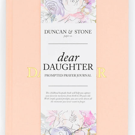   Pink color journal with gold foil text saying, “Dear Daughter” in center.