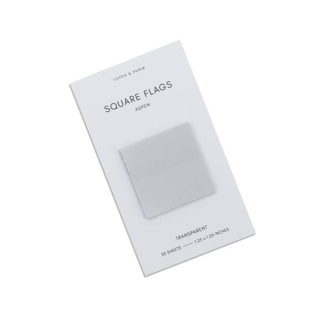 Square sticky notes in gray shades presented on a ivory background.