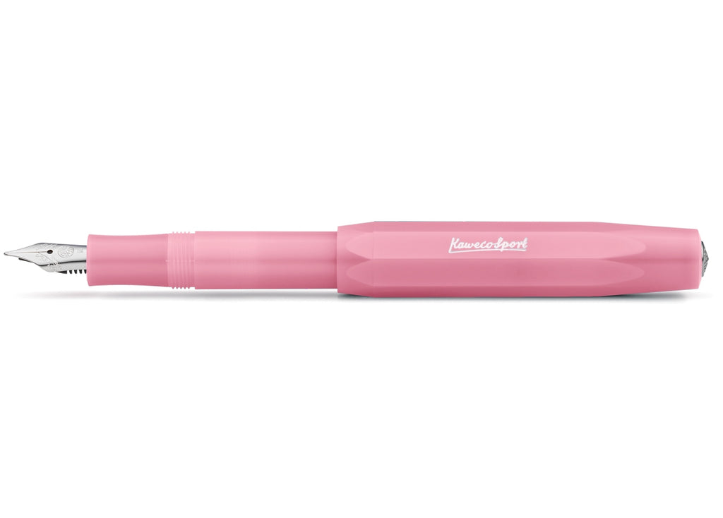 Blush pink pen with brass nib tip.