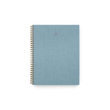 Slate blue textured cover with brass spiral on left side.