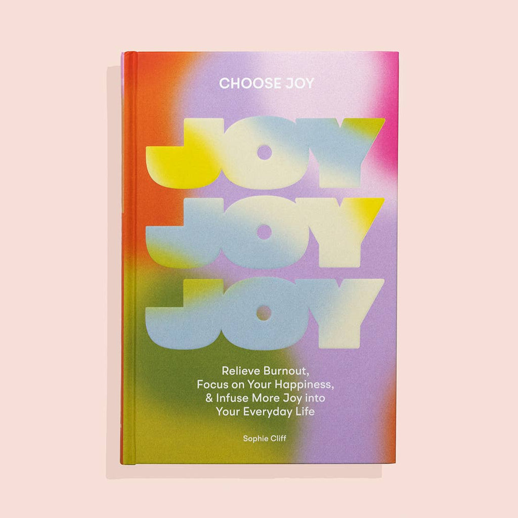 Rainbow cover with wide text letters saying, “Joy Joy Joy Relieve Burnout, Focus on Your Happiness & Infuse More Joy into Your Everyday Life”. 