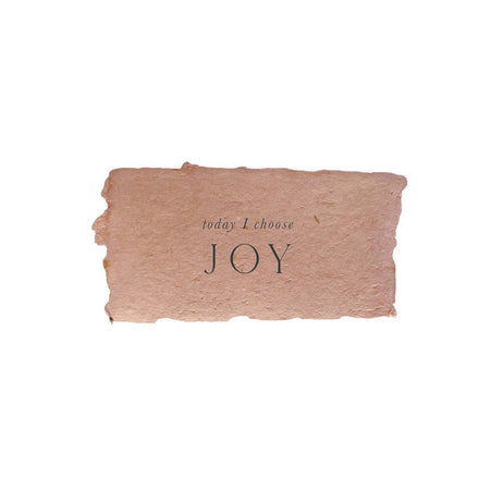 Red rectangle with torn edges and black text saying, “Today I Choose Joy”.