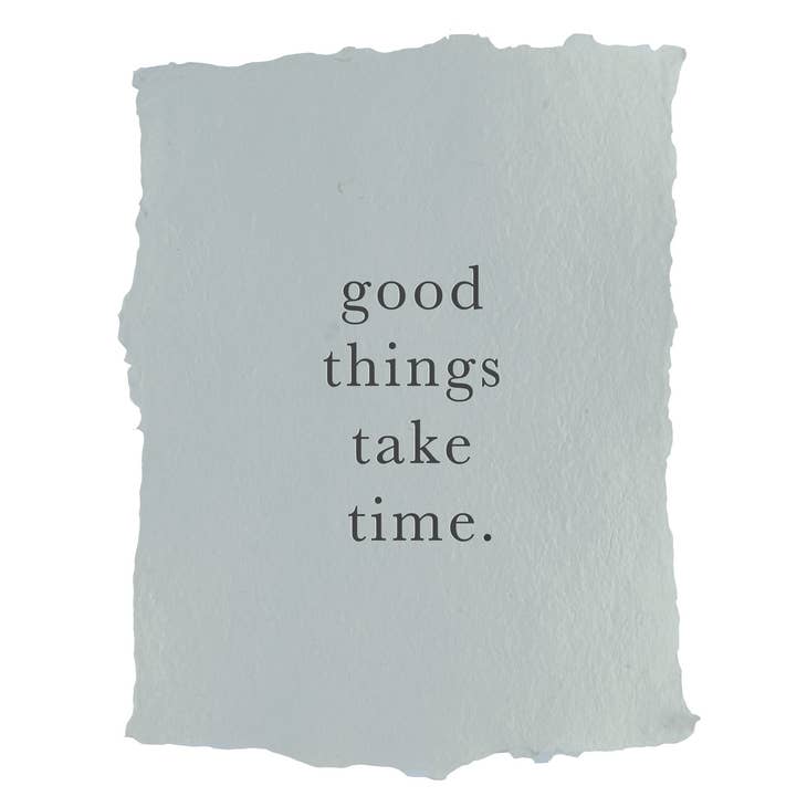 Art print on gray paper with black text saying, “Good Things Take Time”.