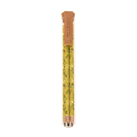 Plastic tube with a cork lid filled with floral designed pencils.