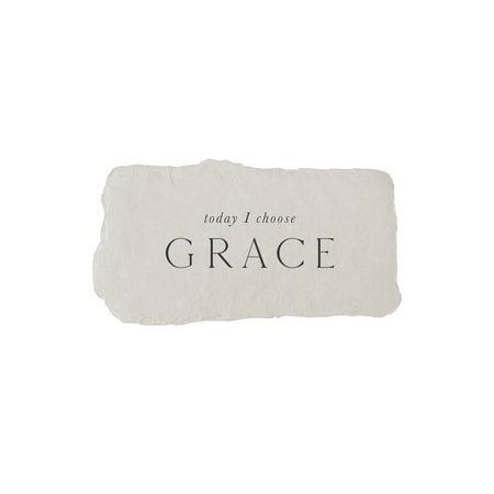 Gray rectangle with torn edges and black text saying, “Today I Choose Grace”.