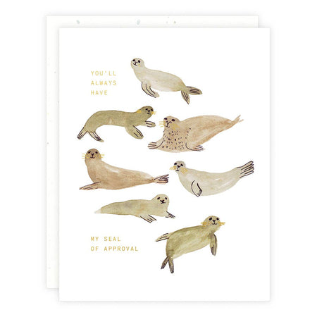 Ivory card with gold foil text saying, “You’ll Always Have My Seal of Approval.” Image of several gray and brown seals. A white envelope is included.