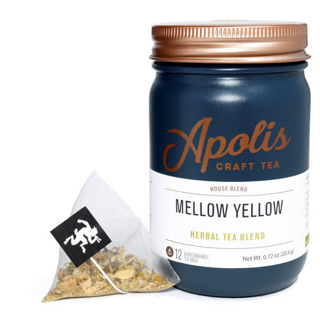 Blue jar with brass lid and white label. Brown text saying, “Apolis Craft Tea”. White label with blue and yellow text saying, “Mellow Yellow Herbal Tea Blend”.