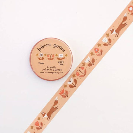 Light orange washi tape with repeating images of red foxes, pink flowers and white flowers.