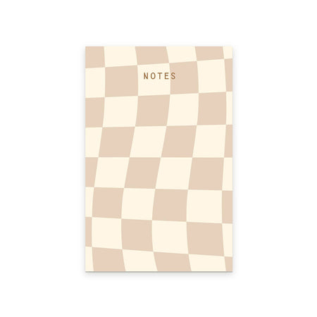 Cover with checkerboard design in ivory and tan squares. Black text saying, “NOTES” in top center.