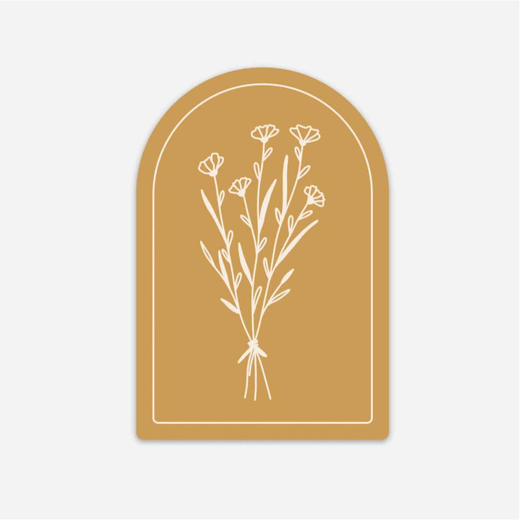 Mustard color sticker in the shape of a window arch with a white floral bouquet in center.