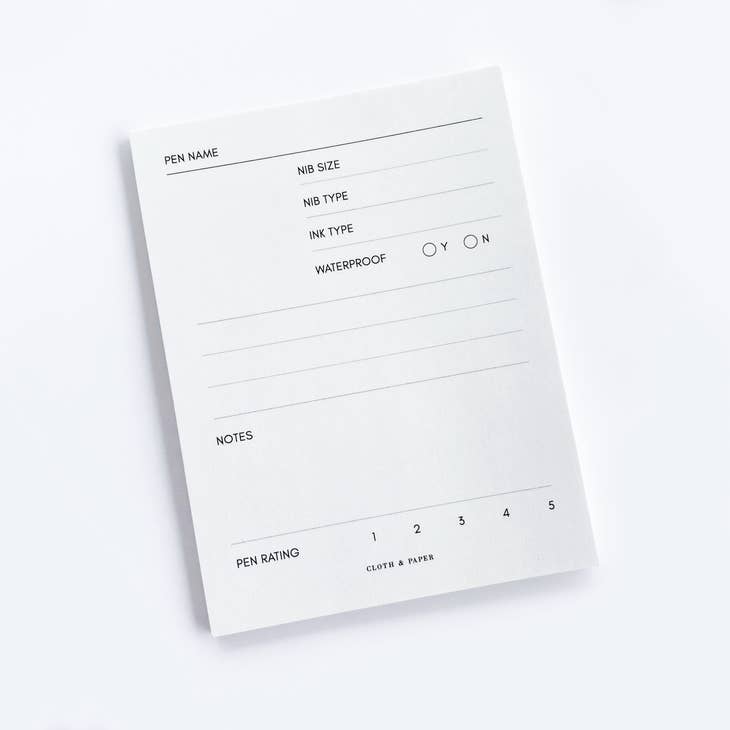 Rectangle white sticky note pad with black text listing the different testing options: pen name, nib size, nib type, ink type, waterproof, notes, and pen rating.