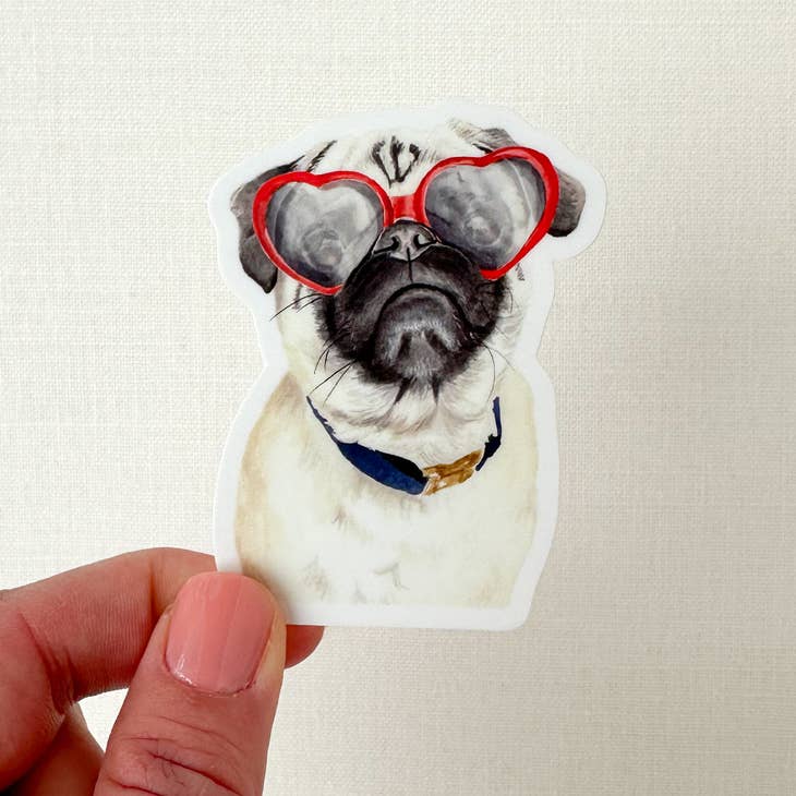 Sticker in the image of a white and black pug dog wearing a blue collar and red heart shaped sunglasses.