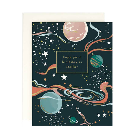 Black card with space scene: various planets, white stars, and colored swirls. Gold foil text saying, 
