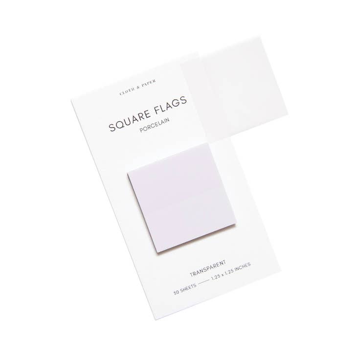 Square sticky notes in white shades presented on a ivory background.