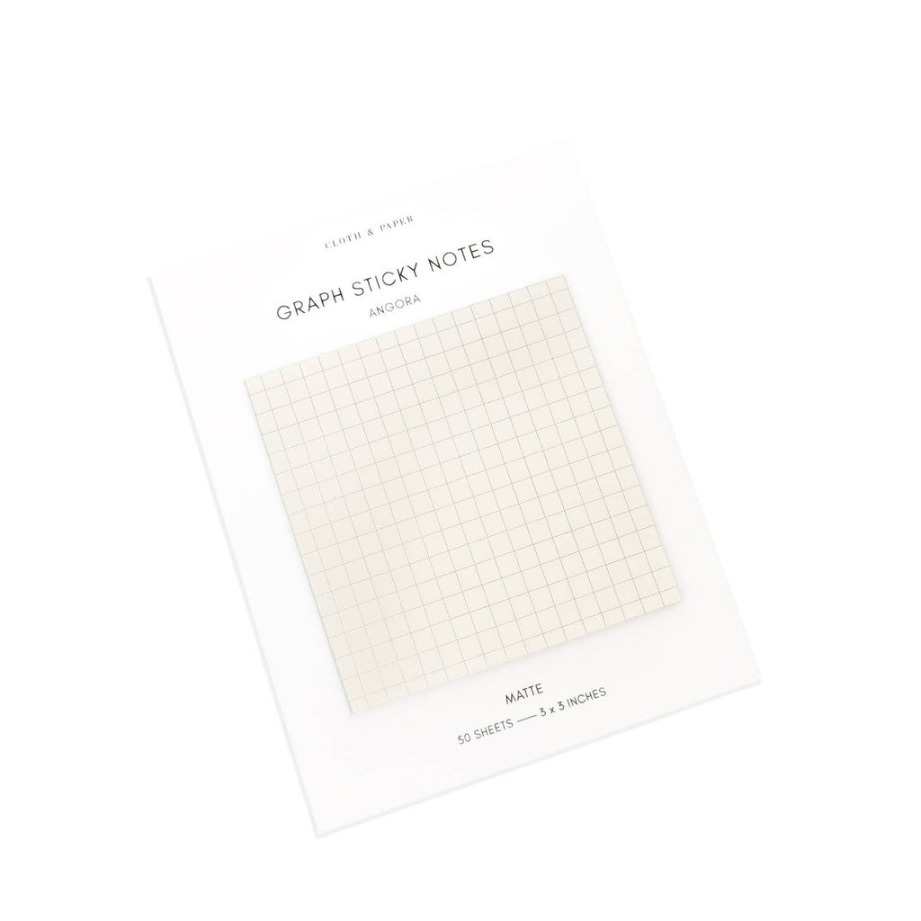 Square graph lined sticky notes on ivory paper.