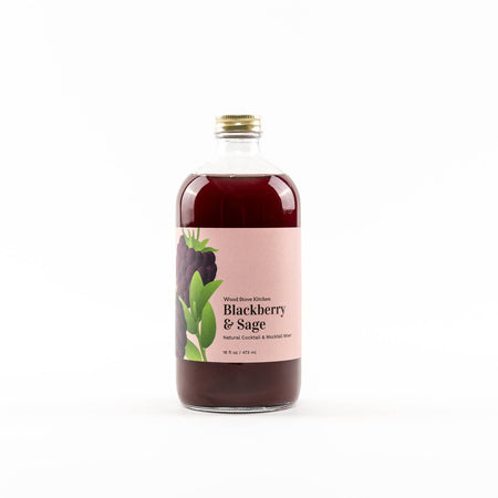 Glass bottle with dark purple liquid encompassing the flavors of blackberry and sage. Label on bottle with images of blackberries and sage leaves.