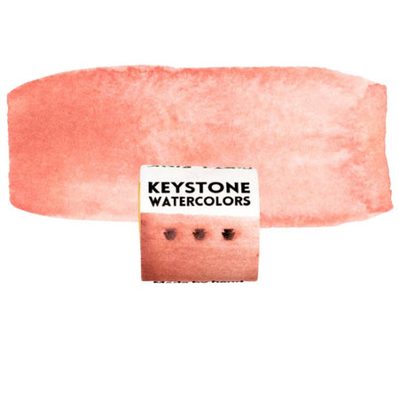 Paint cube in dusty pink color with white label and black text saying, “Keystone Water Colors”.