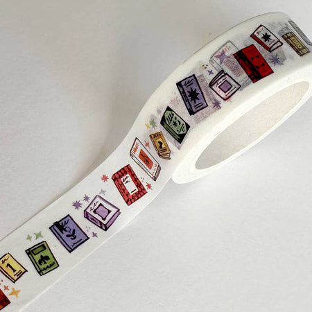 White background washi tape with images of multi colored books. 