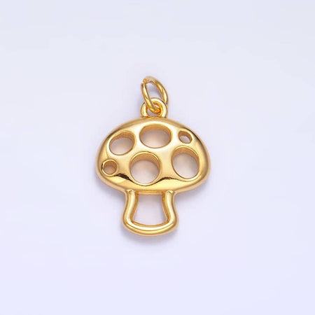 Gold charm in the image of a gold mushroom.