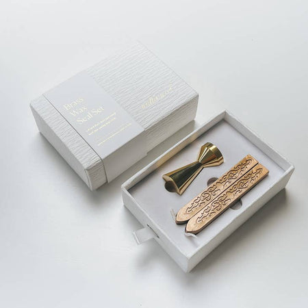 Packaged in a white box. Brass metal wax stamp come with two brown wax sticks.