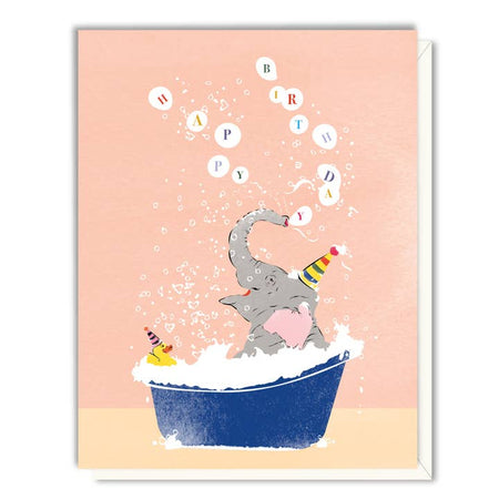 Pink card with images of an elephant wearing a party hat taking a bath in a blue tub with a yellow rubber duck and bubbles. Colorful text saying, “Happy Birthday”.  A white envelope is included.