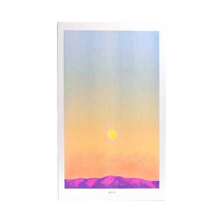 Art print of purple mountain range with orange and yellow moon rising to a blue sky.