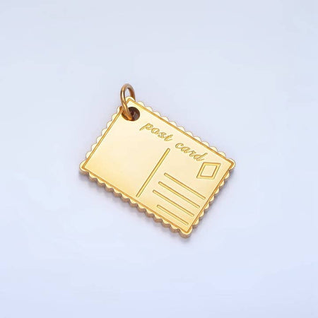 Gold charm in the image of a blank postcard.