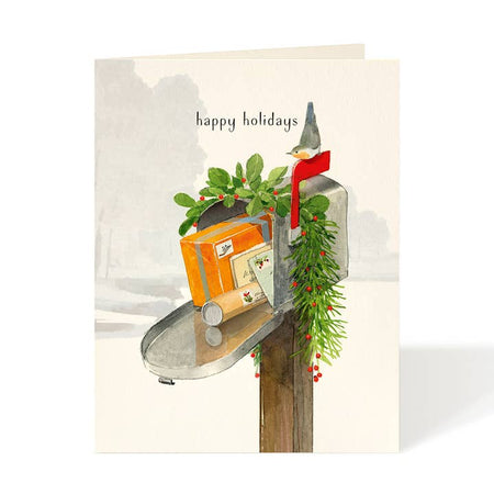 White card with image a metal mailbox decorated with Christmas greenery and packages coming out. Black text saying, “Happy Holidays”. A white envelope is included.