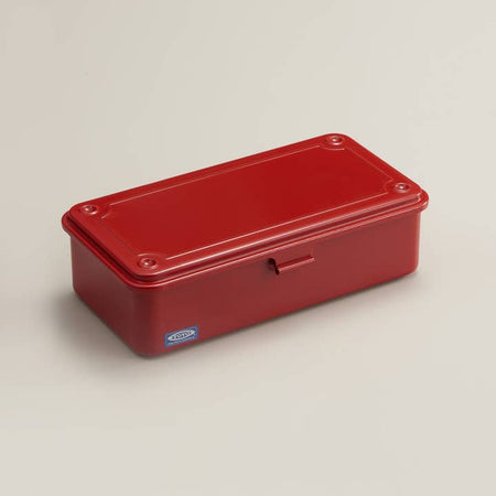 Red long rectangular steel toolbox with front latch.