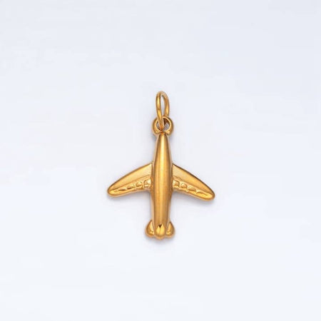 Gold charm in the image of an airplane.