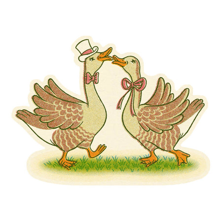 Sticker in the image of two brown geese kissing. One goose is dressed as a man wearing a top hat and a bowtie. The other goose is dressed as a woman wearing a pink bow around her neck.