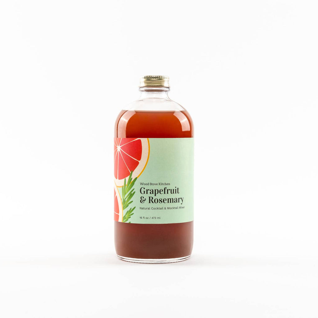 Glass bottle with red liquid encompassing the flavors of grapefruit and rosemary. Label on bottle with images of grapefruit wedges and rosemary sprigs.
