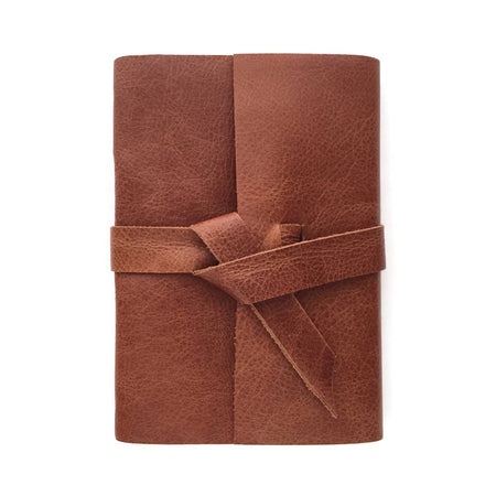 Golden Brown soft leather cover with two leather straps crossed in the middle.