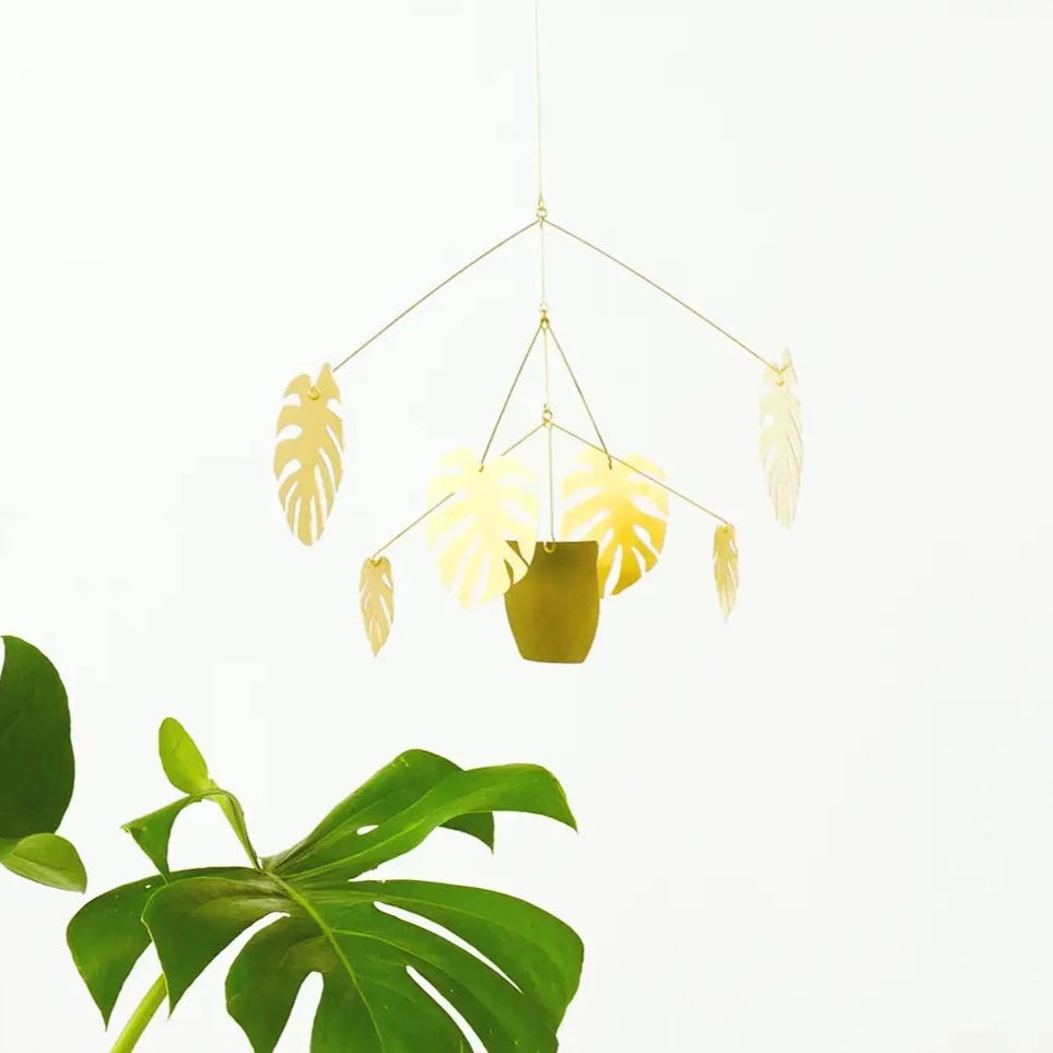 Brass fixture in the image of fern leaves hanging down.