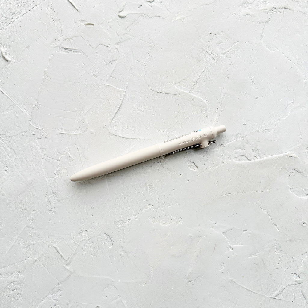 Ivory pen on white textured background