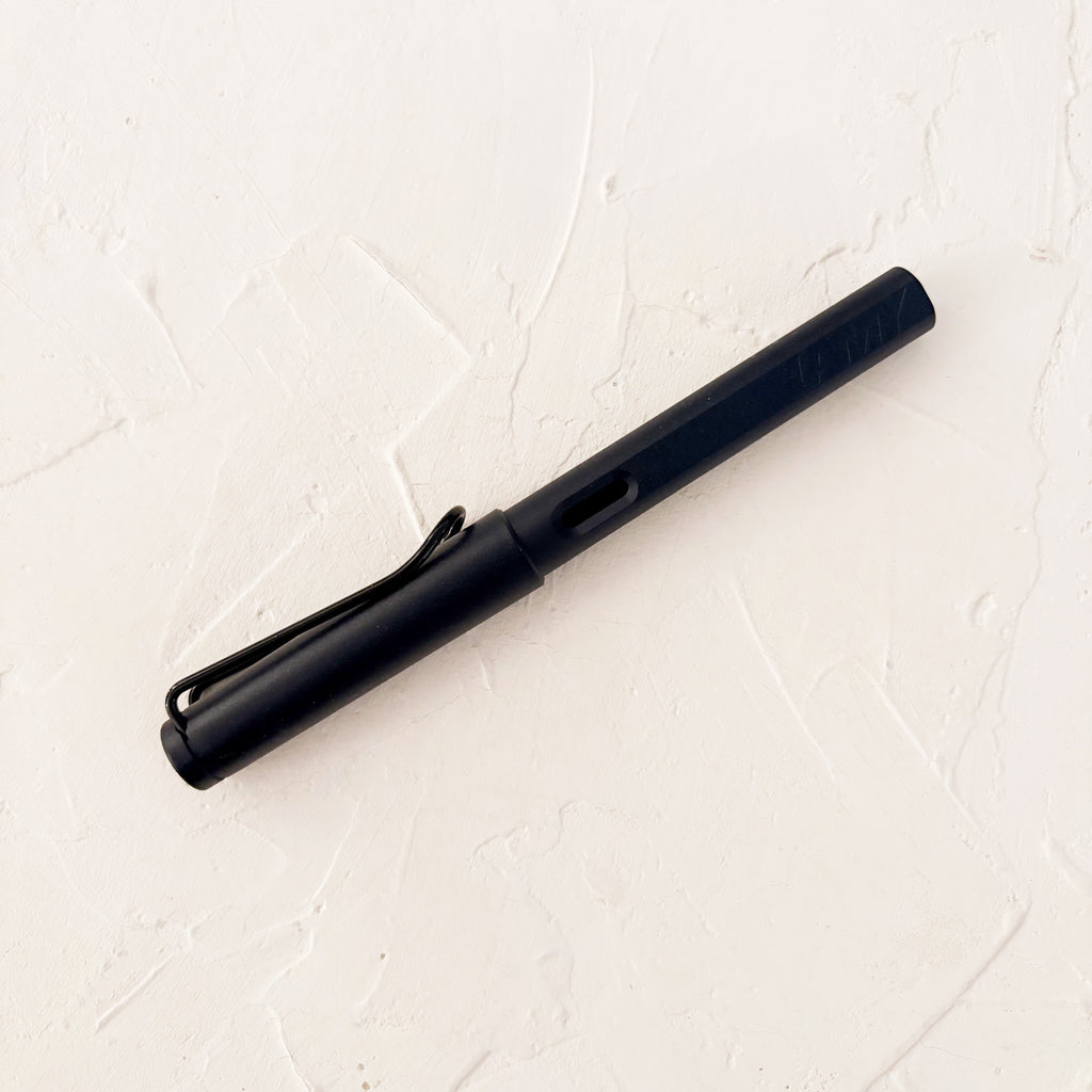 black fountain pen on textured background