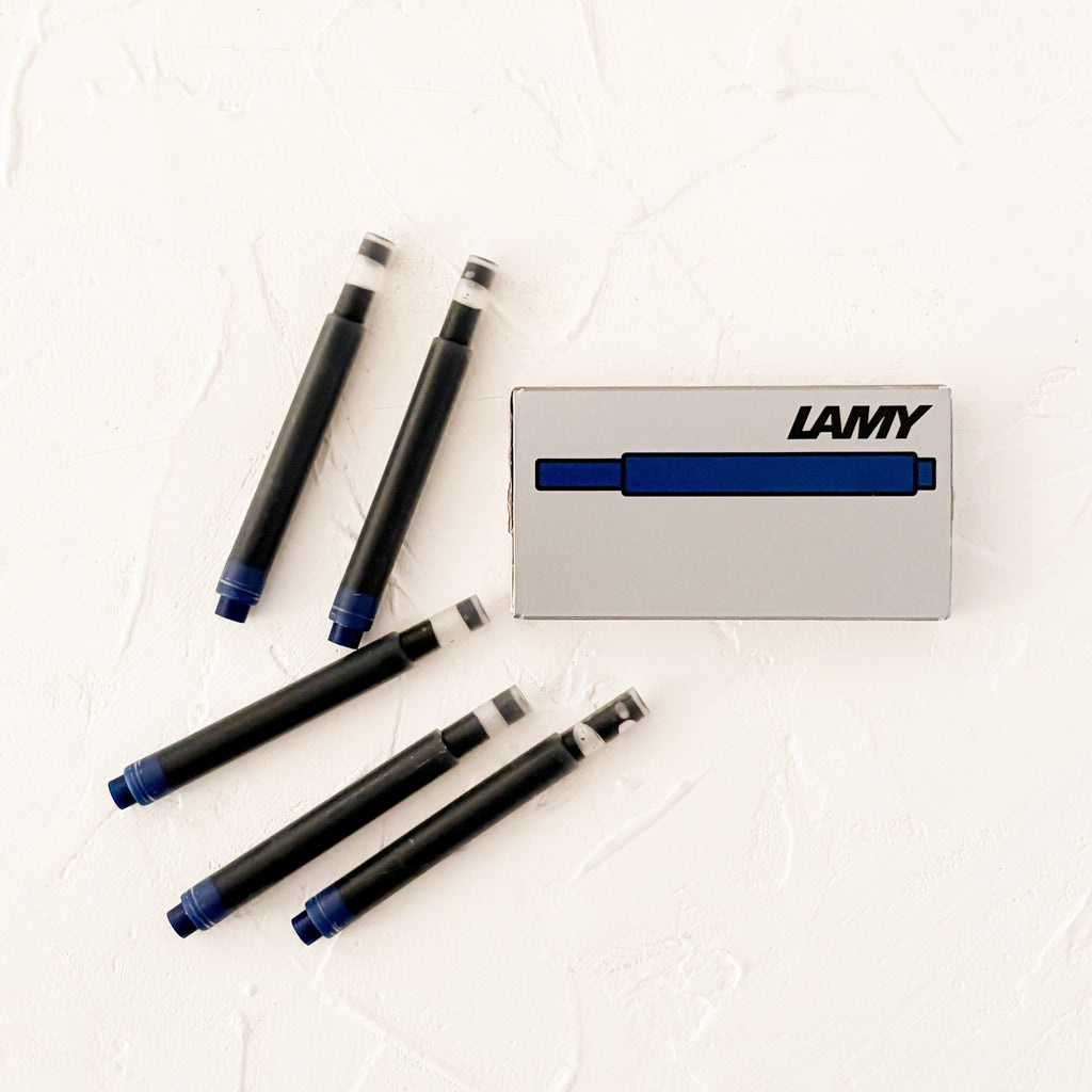blue/black ink cartridges on textured background