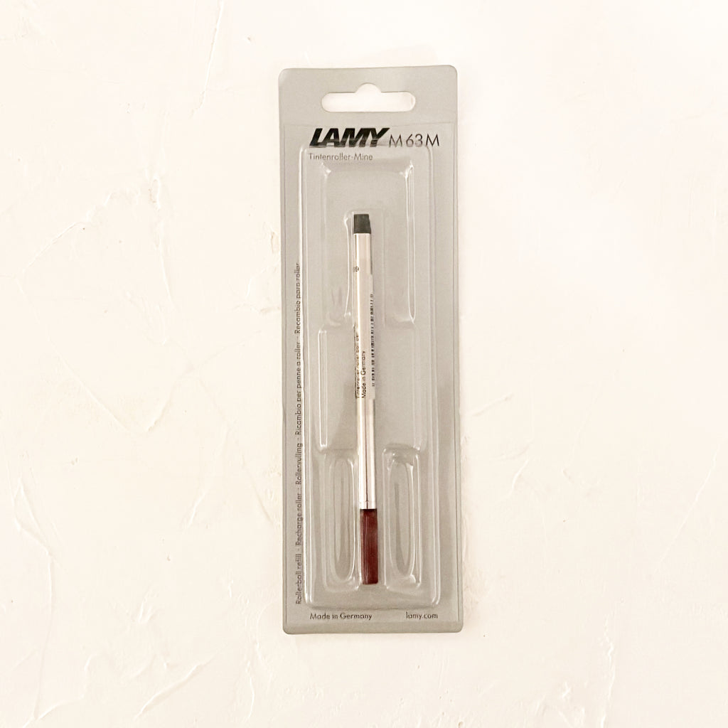 rollerball pen refill on textured background