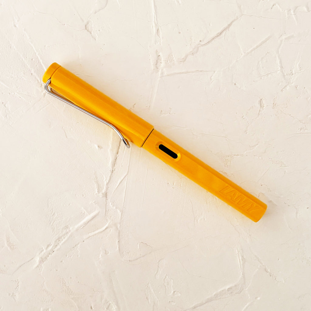 yellow pen on textured background